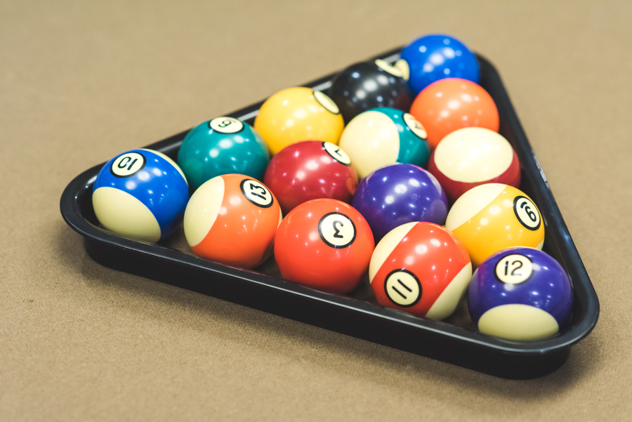 racked-pool-balls-brown-felt-pool-table
