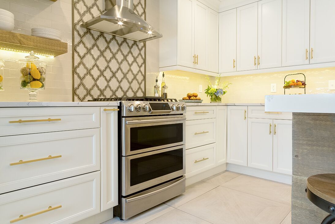 white-cabinets-gold-fixtures-hardware-kitchen-design