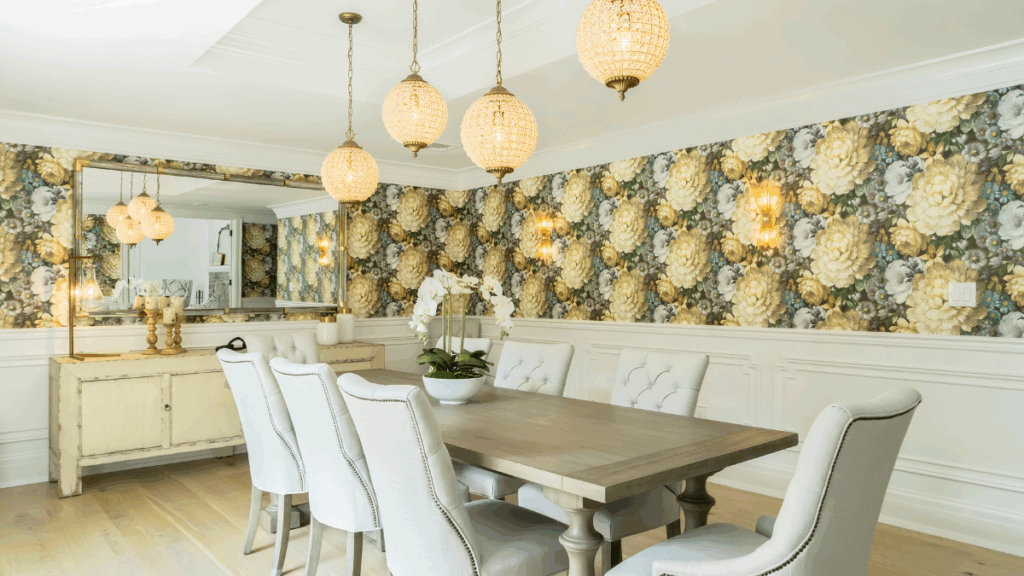 Statement dining room with dramatic floral wallpaper and crystal globe lighting, a bold and collected design by MSI.