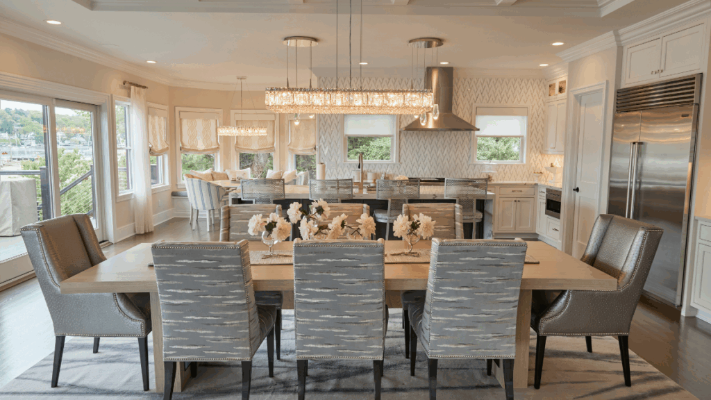 Expansive open-concept kitchen and dining room with coastal views and layered luxury finishes by MSI.